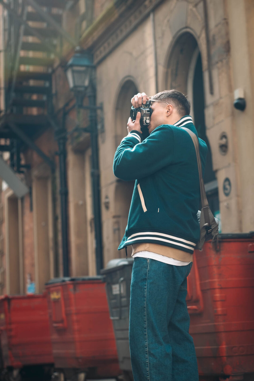 a man taking a picture with a camera.